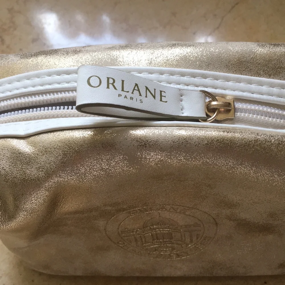 Gold distressed Orlane Paris makeup/cosmetic bag